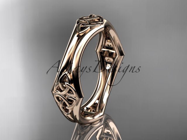 14K rose gold Celtic trinity knot wedding band shown at an angle, displaying its openwork design.