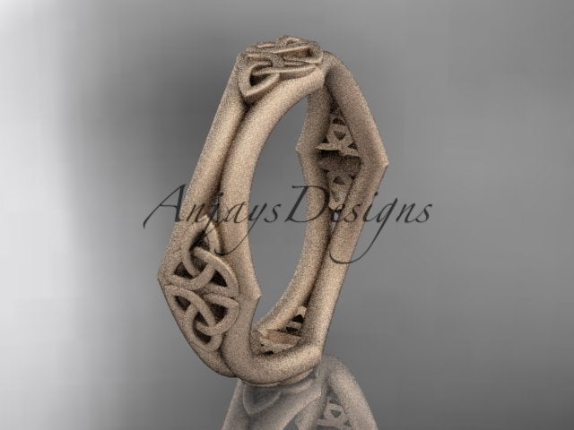 14K rose gold matte Celtic wedding band with an open geometric shape and trinity knot details, shown at an angle.