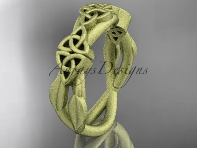 14K yellow gold Celtic trinity knot wedding band with flowing leaf details, shown at an angle.