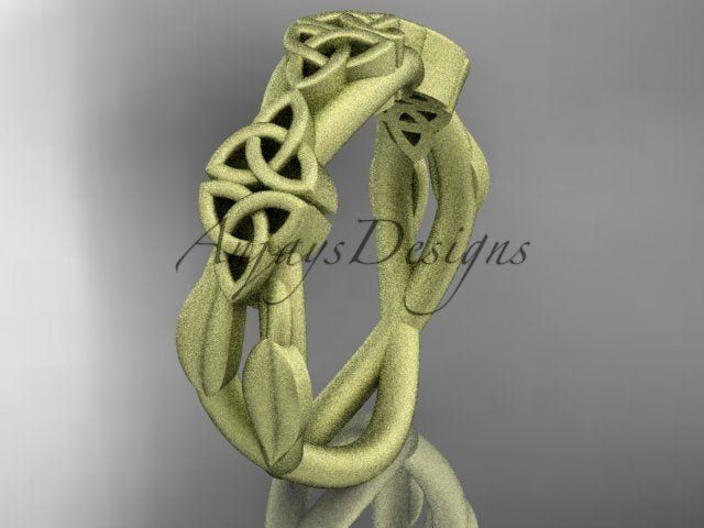 14K yellow gold Celtic trinity knot wedding band with flowing leaf details, shown at an angle.