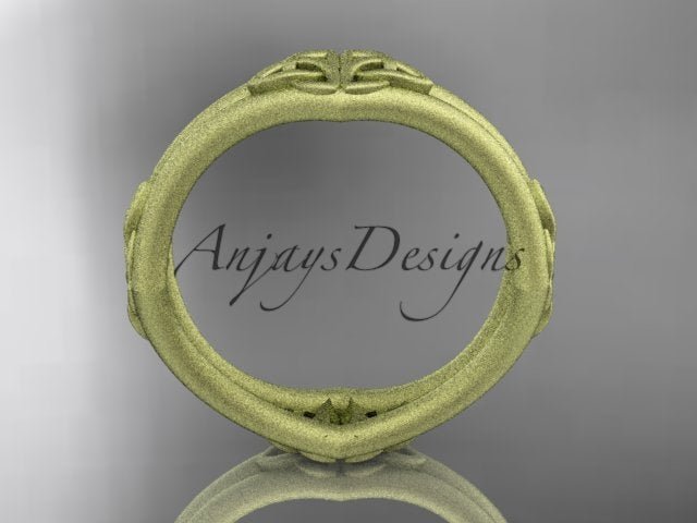 14K yellow gold matte Celtic wedding band showing the circular inner band and exterior knot details.