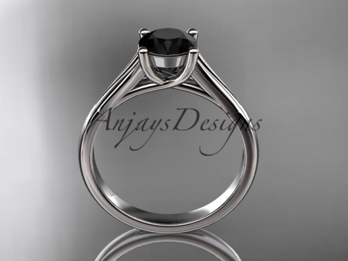 Sculpted prongs surrounding the round black diamond