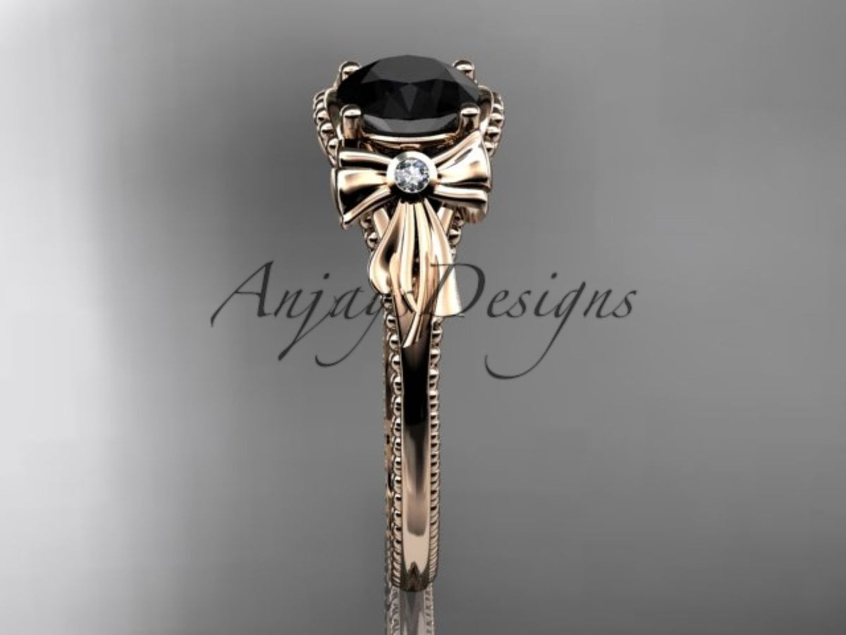 Sculpted bow detail beneath the black diamond center stone