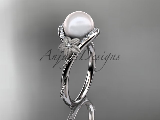 Three-quarter studio angle displaying high-polish yellow gold luster and prominent pearl centerpiece