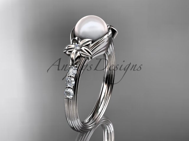 Side view of the pearl engagement ring showing its sculpted setting