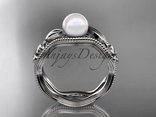 Rose gold pearl ring with diamond accents and textured detailing