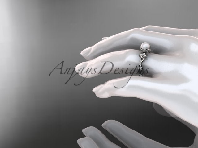 On-finger showcase of the delicate 14K white gold pearl blossom engagement ring AP388
