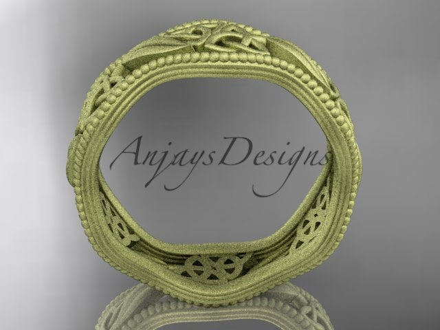 Studio lighting showcasing warm 14K yellow gold tone and matte finish texture on Celtic leaf ring CT7190G