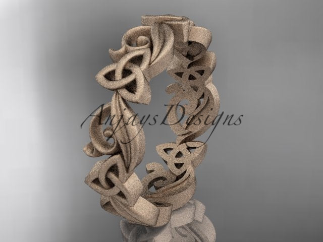 Studio lighting highlighting matte gold texture and diamond accents on Celtic band CT7191B