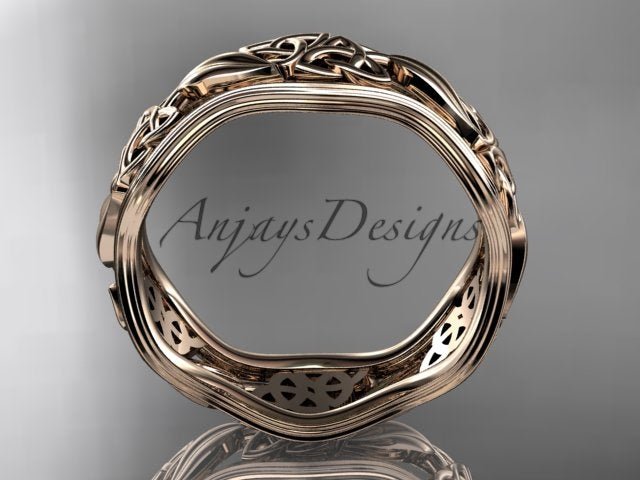 Studio lighting showcasing warm 14K yellow gold tone and polished finish on Celtic leaf ring CT7504G