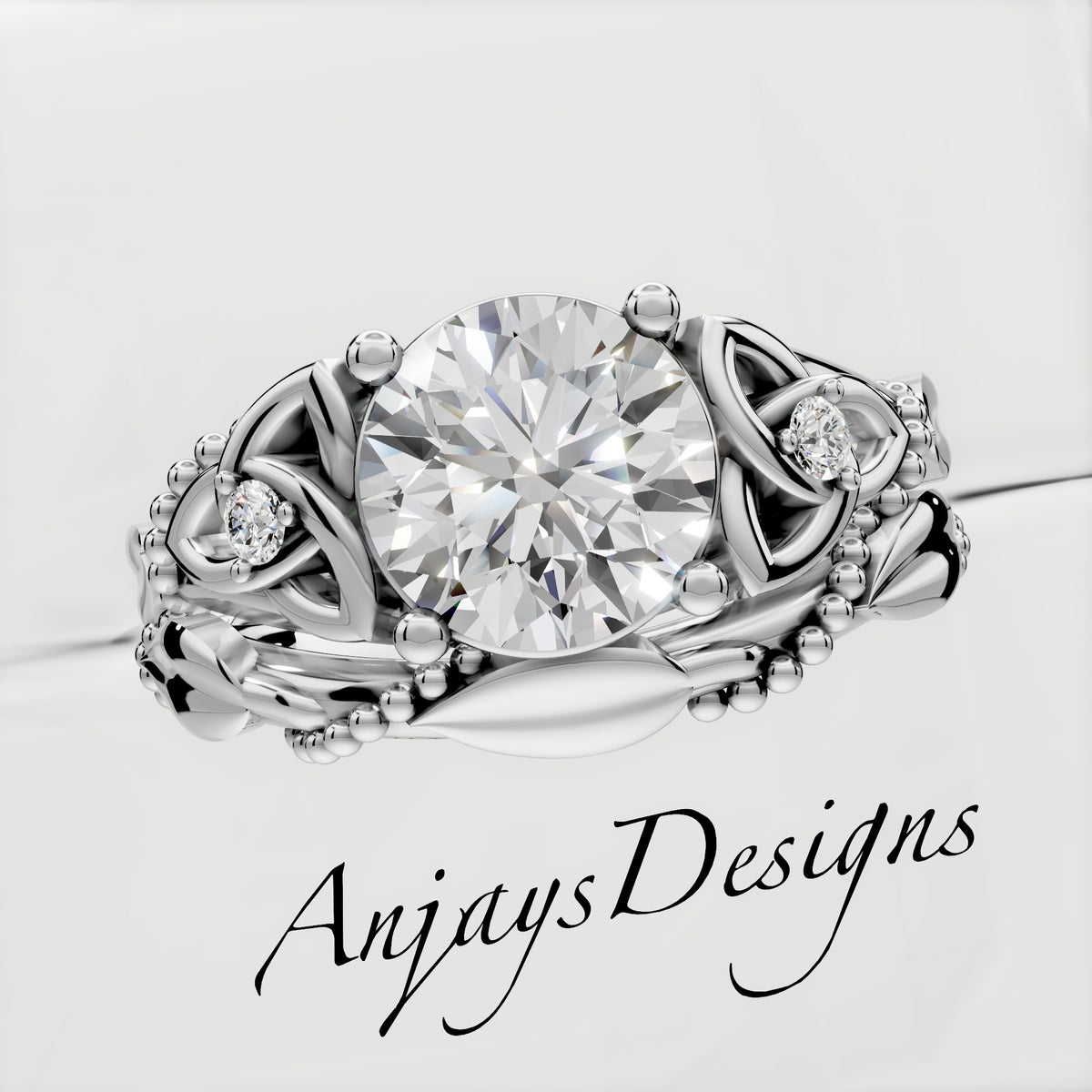 Celtic Trinity Knot engagement ring with matching leaf vine band