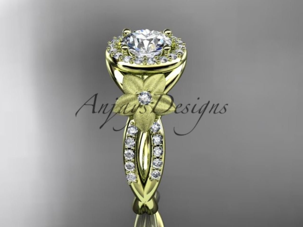 Yellow gold diamond engagement ring, style ADLR127. Front view showcasing the central round diamond halo and a matte-finish flower detail accenting the split diamond-pave band.