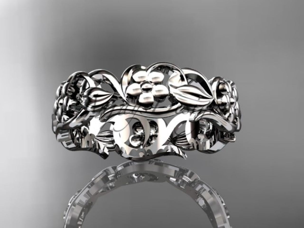 • White gold floral wedding band, style ADLR537G. Laid flat horizontally, displaying the repeating pattern of central flowers and surrounding leaves.
5. image_l6mAQG.png