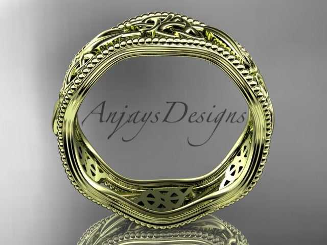 Yellow gold Celtic wedding band, style CT7508P. Side profile view showing the wavy circular silhouette of the band and the hollow openwork filigree carved through the yellow gold inner lining.