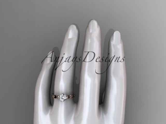 Side view of leaf inspired engagement ring with round brilliant lab grown diamond in 14k rose gold
