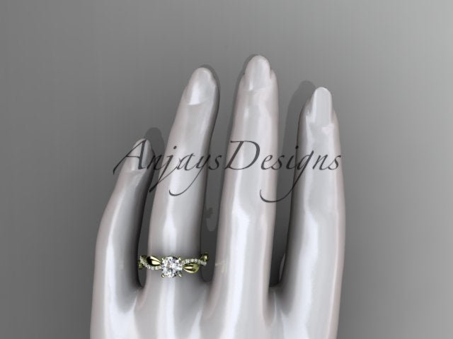 Close up of nature inspired leaf ring with round D VS1 lab grown diamond in 14k yellow gold
