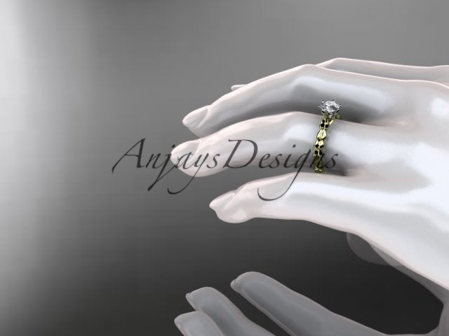 Close up of nature inspired leaf engagement ring with 1 carat round brilliant lab grown diamond in 14k yellow gold