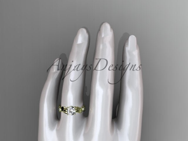 Close up of leaf and vine engagement ring with 1 carat round lab grown diamond in 14k yellow gold