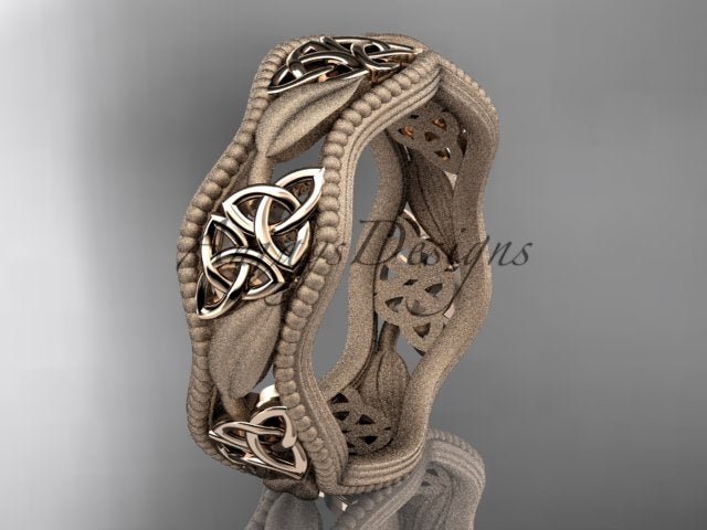 Rose gold Celtic wedding band with leaf motifs and trinity knot accents