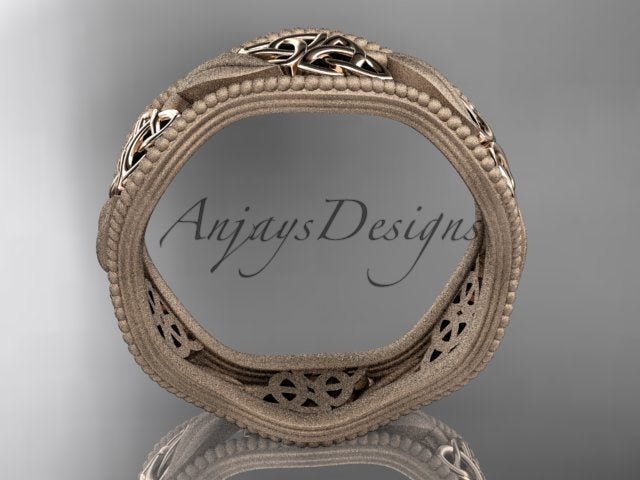 Rose gold wedding band with a continuous decorative leaf pattern