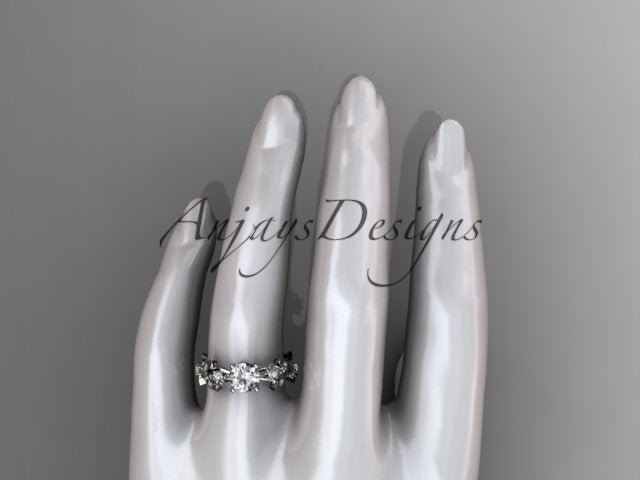 Side view of nature inspired engagement ring with round brilliant lab grown diamond in 14k white gold