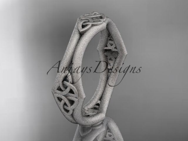 White metal matte Celtic wedding band with an open geometric shape and trinity knot details, shown at an angle.