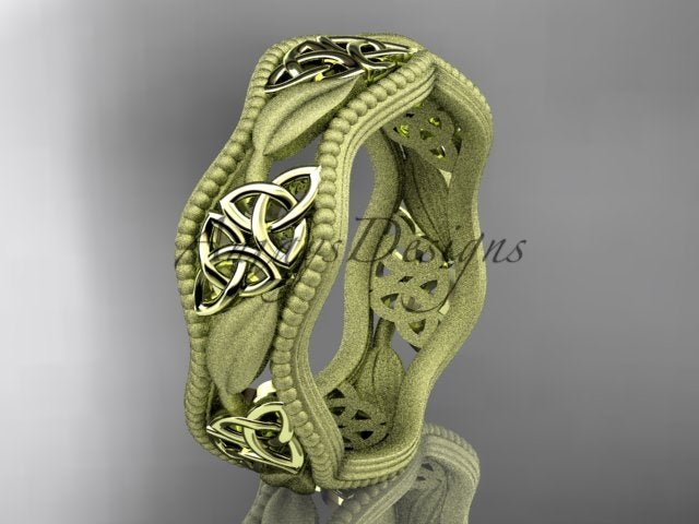 Yellow gold Celtic wedding band with leaf motifs and trinity knot accents