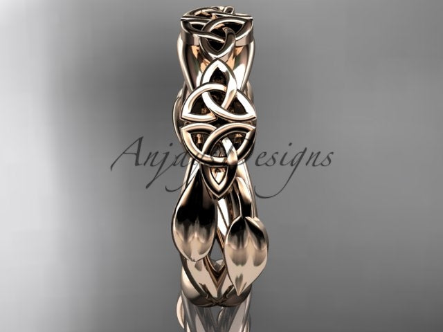 14K rose gold Celtic trinity knot wedding band showing the inner band structure.