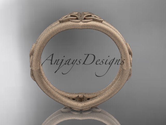 14K rose gold matte Celtic wedding band showing the circular inner band and exterior knot details.