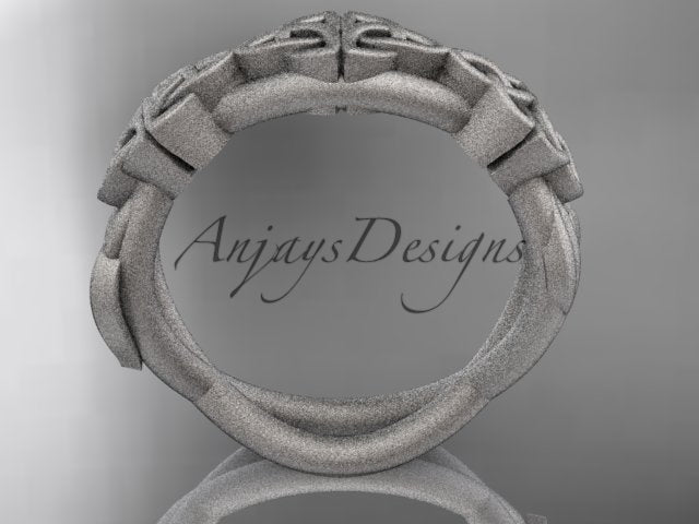White metal Celtic trinity knot wedding band showing the inner band and underside.