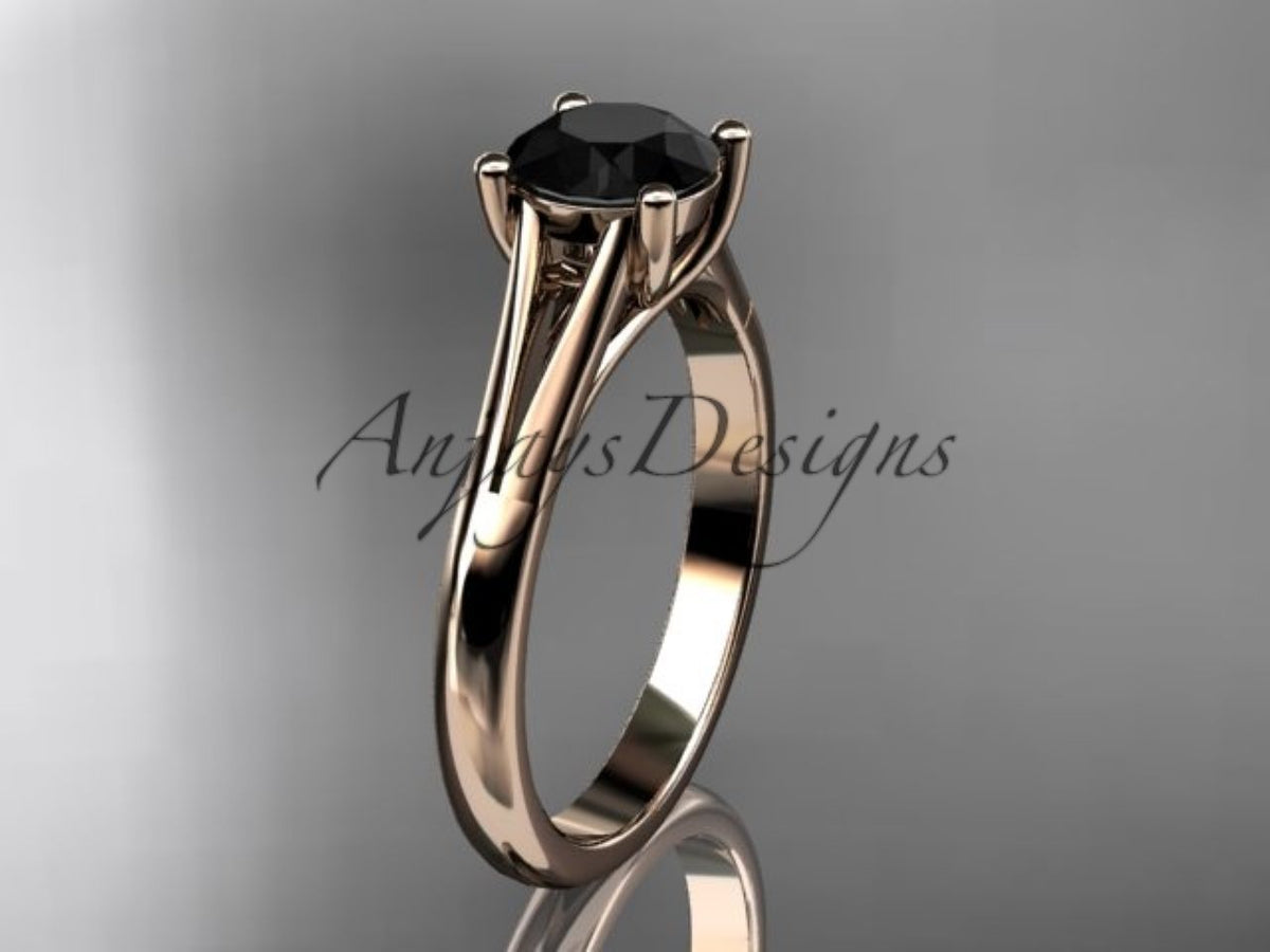 Minimalist yellow gold engagement ring with black center stone

