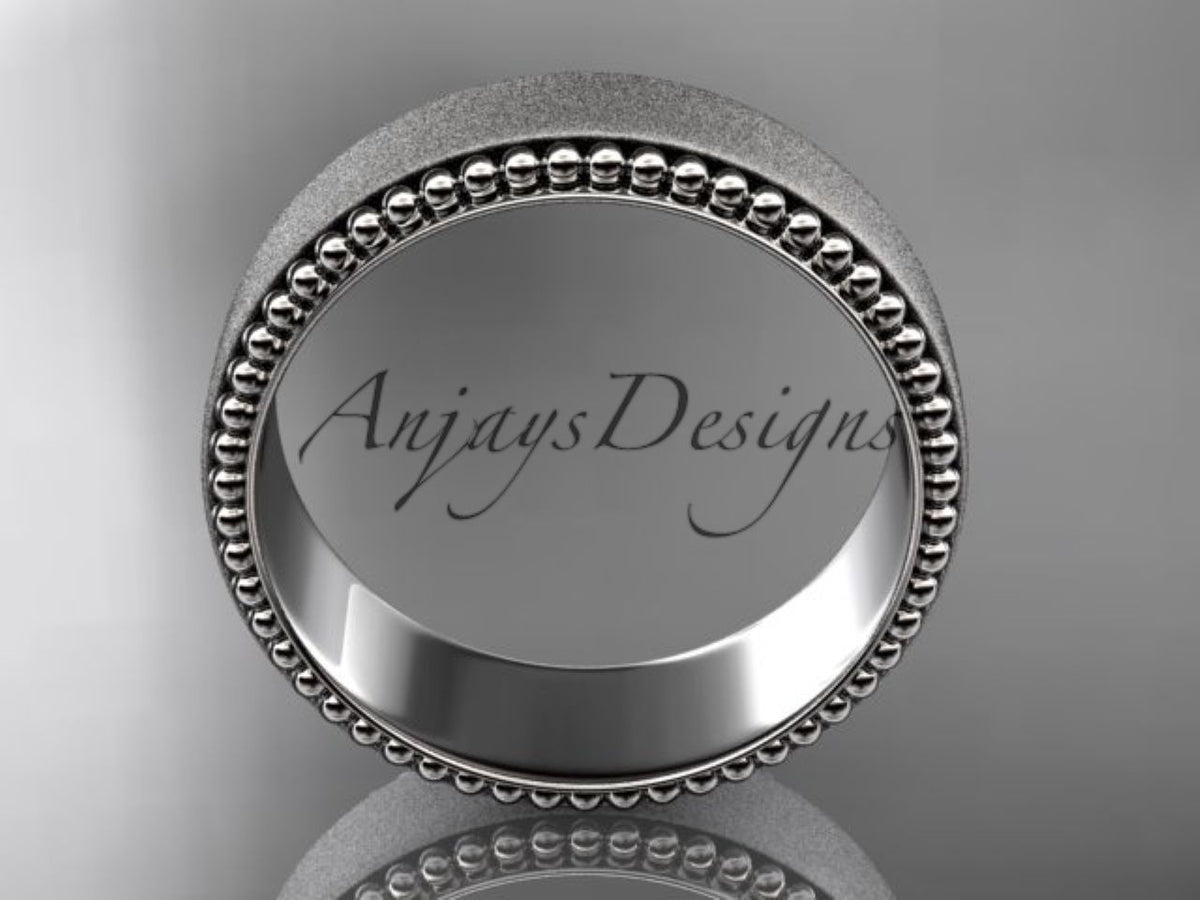 Close-up of decorative beaded borders on a white gold ring