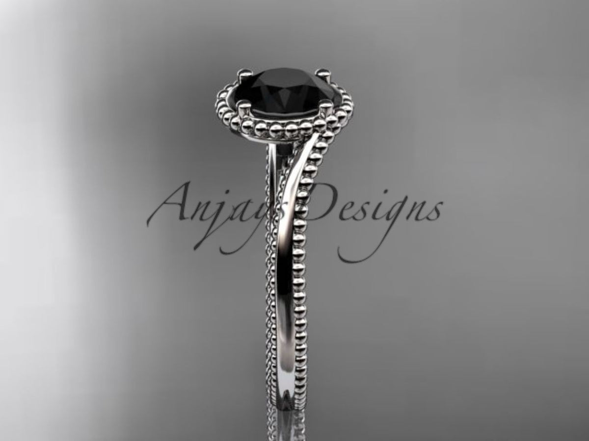 Black diamond held in a classic rose gold solitaire setting
