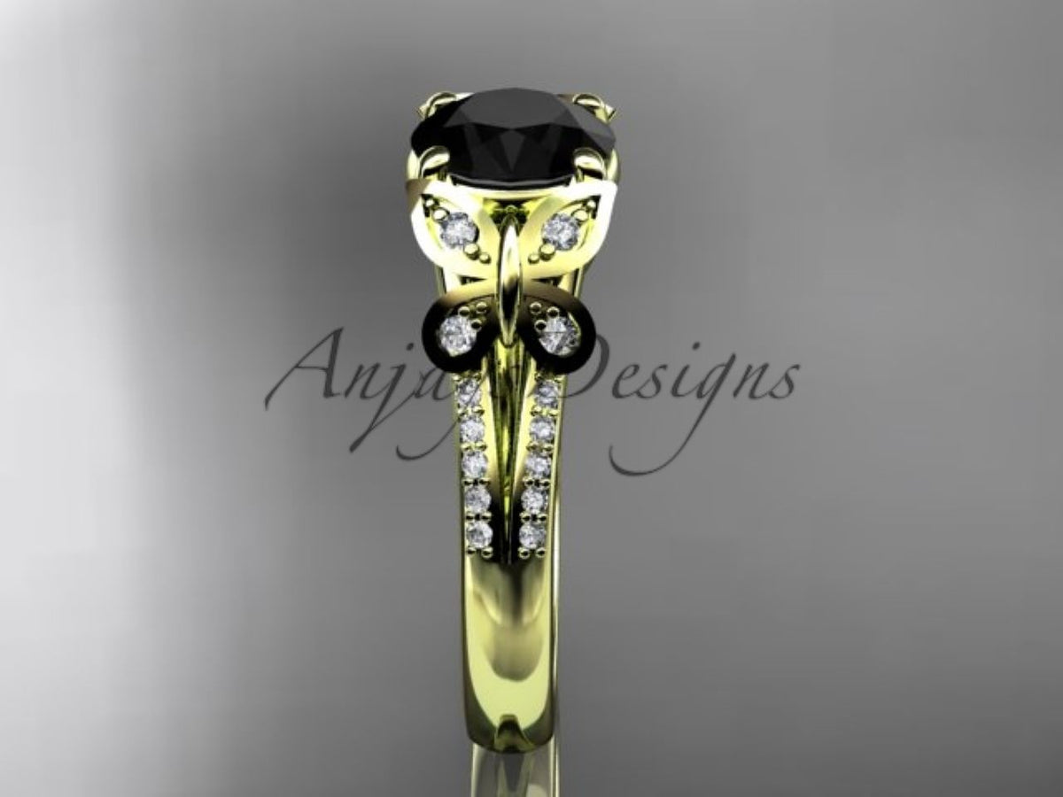 Enhanced black diamond center stone in a yellow gold butterfly setting