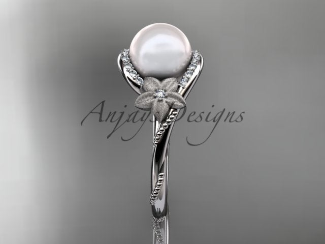 Smooth interior band construction and openwork basket beneath the 9mm pearl centerpiece   