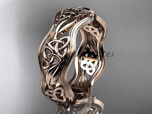 Close-up macro detail of intricate Celtic trinity knot and organic leaf pattern on 14K yellow gold band CT7504G