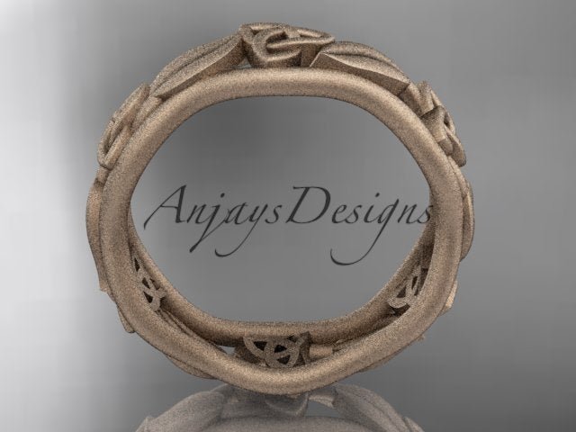 Rose gold Celtic wedding band, style CT7105B. Side profile view showing the fluid, contoured inner band contours and cut-out filigree spaces.