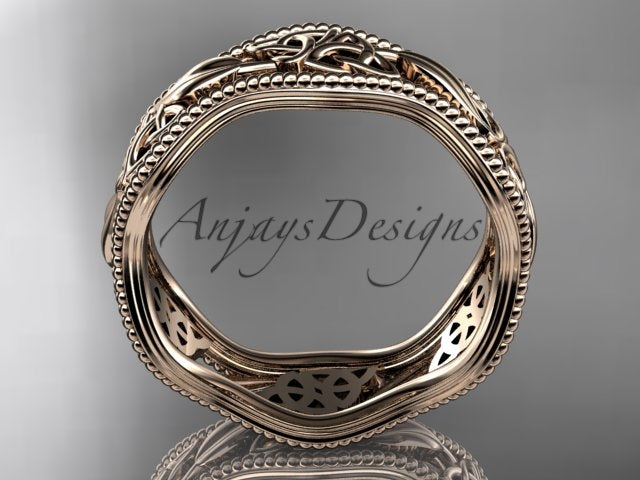 • Rose gold Celtic wedding band, style CT7508P. Side profile view showing the wavy circular band shape and the hollow filigree detailing carved through the inner lining.
