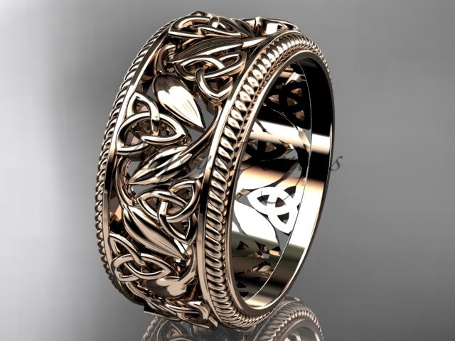 Rose gold wide Celtic wedding band, style CT7508P. Three-quarter view showcasing a wide, patterned rope milgrain band detailed with intricate openwork Celtic trinity knots and polished leaf motifs.
