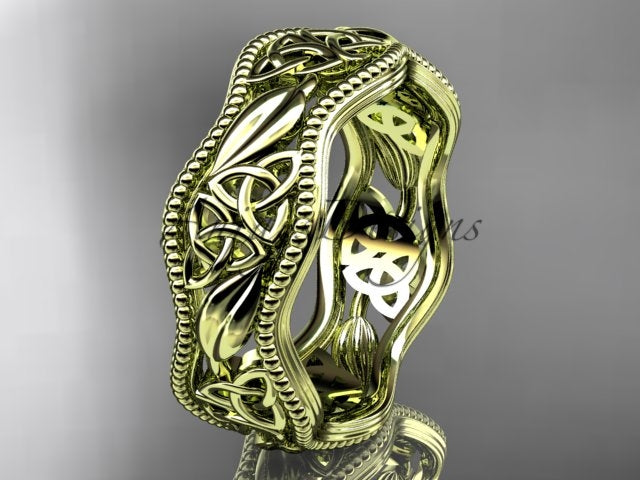 Yellow gold Celtic wedding band, style CT7508P. Three-quarter view showcasing the vibrant yellow gold option with delicate hand-carved Celtic knots and raised leaf shoulders.