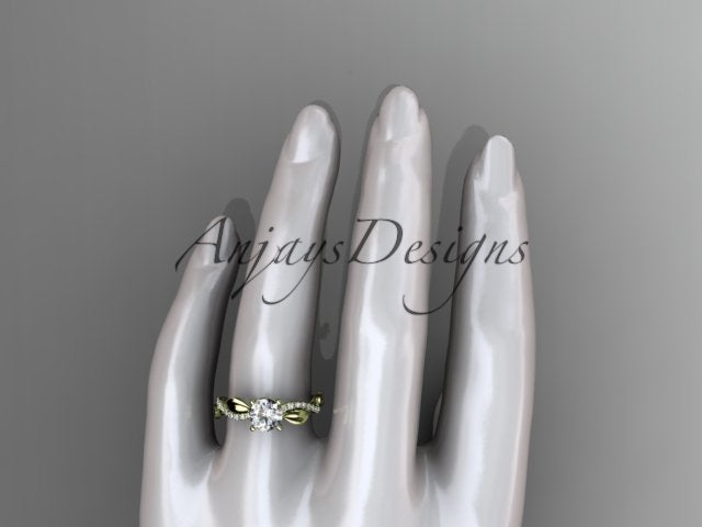 Close up of nature inspired leaf ring with round D VS1 lab grown diamond in 14k yellow gold
