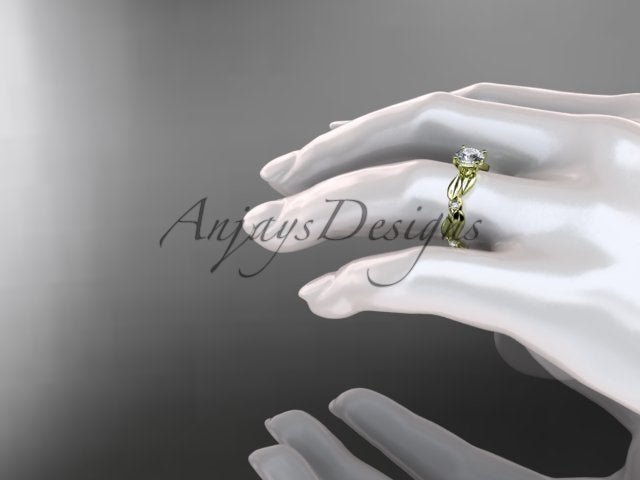 Side view of leaf and vine engagement ring with round lab grown diamond in 14k yellow gold